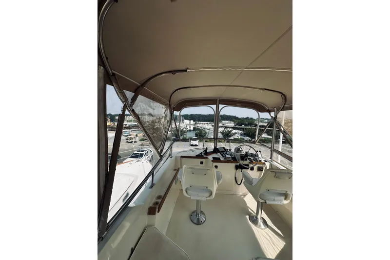 Slide: The Image of Interior view of 1996 Sabreline 36 Sedan boat cockpit with steering wheel and seats. - 88