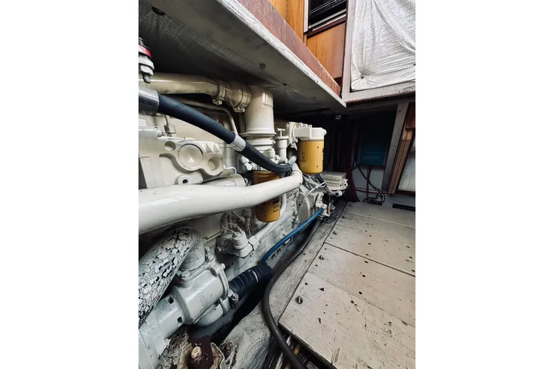 Slide: The Image of Engine compartment of a 1996 Sabreline 36 Sedan boat, showcasing mechanical components. - 68