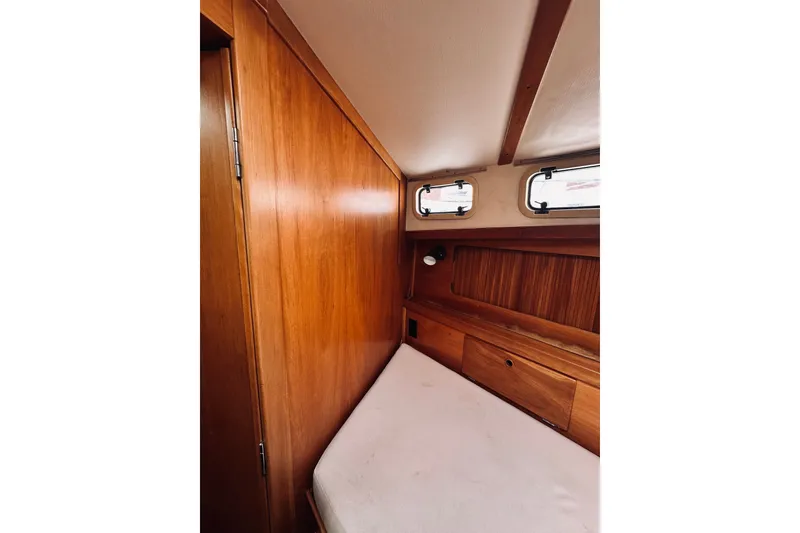 Slide: The Image of Cozy cabin interior of 1996 Sabreline 36 Sedan with wooden finish and small windows. - 39