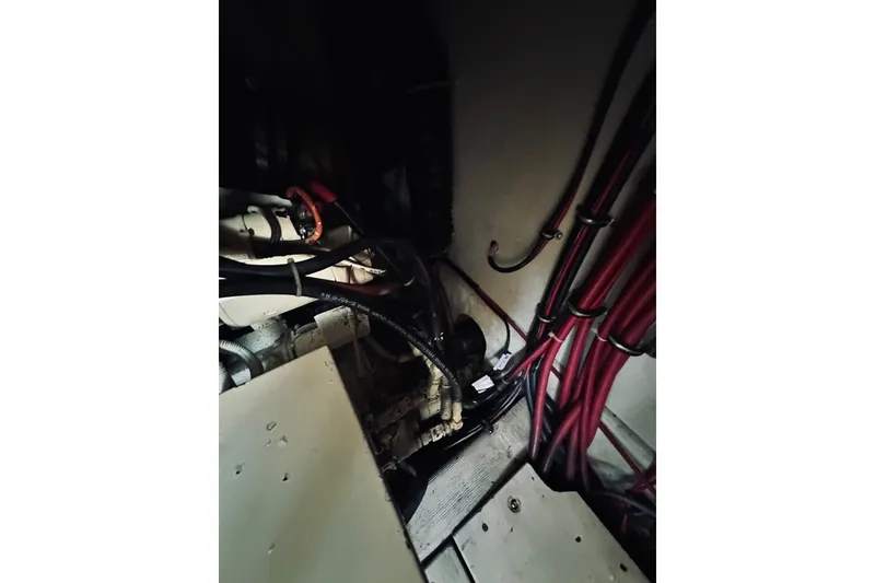 Slide: The Image of Engine room of a 1996 Sabreline 36 Sedan with visible wiring and components. - 71