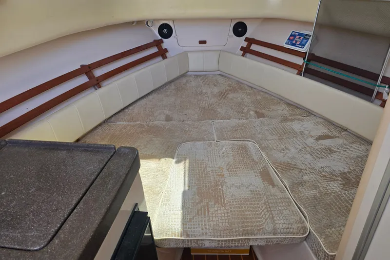 Slide: The Image of Interior cabin of 2008 Grady White 282 Sailfish boat with cushioned seating. - 29