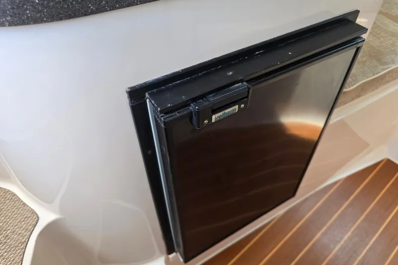 Slide: The Image of Compact refrigerator on 2008 Grady White 282 Sailfish boat interior. - 26