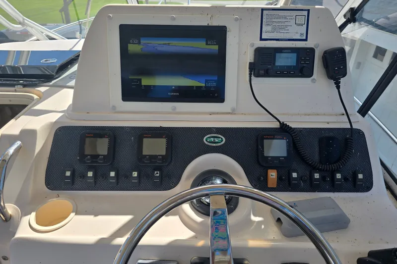 Slide: The Image of Dashboard of a 2008 Grady White 282 Sailfish boat with navigation equipment. - 17