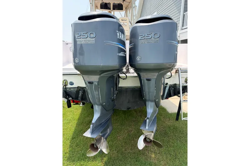 Slide: The Image of Twin Yamaha 250 outboard engines on a 2008 Grady White 282 Sailfish boat. - 32