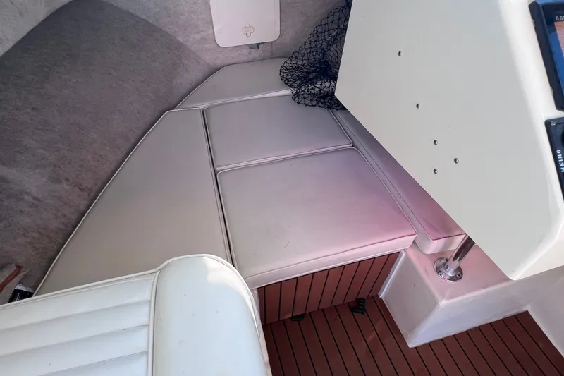 Slide: The Image of Interior cabin of a 2012 Parker 2320 SL Sport Cabin boat with cushioned seating. - 36