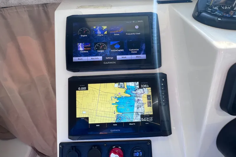 Slide: The Image of Garmin navigation displays on a 2012 Parker 2320 SL Sport Cabin boat dashboard. - 33