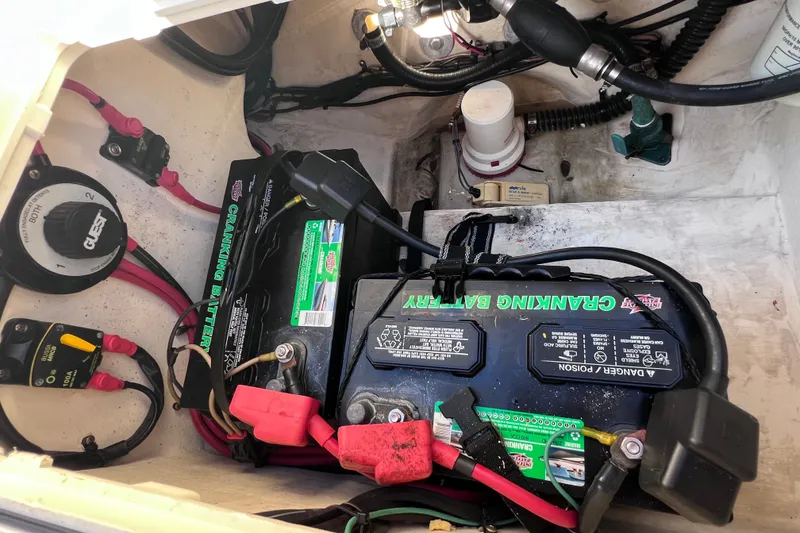 Slide: The Image of Battery compartment of a 2012 Parker 2320 SL Sport Cabin boat with wiring and components. - 38