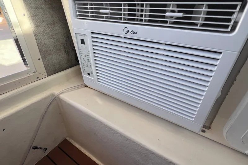 Slide: The Image of Air conditioner installed in a 2012 Parker 2320 SL Sport Cabin boat interior. - 26