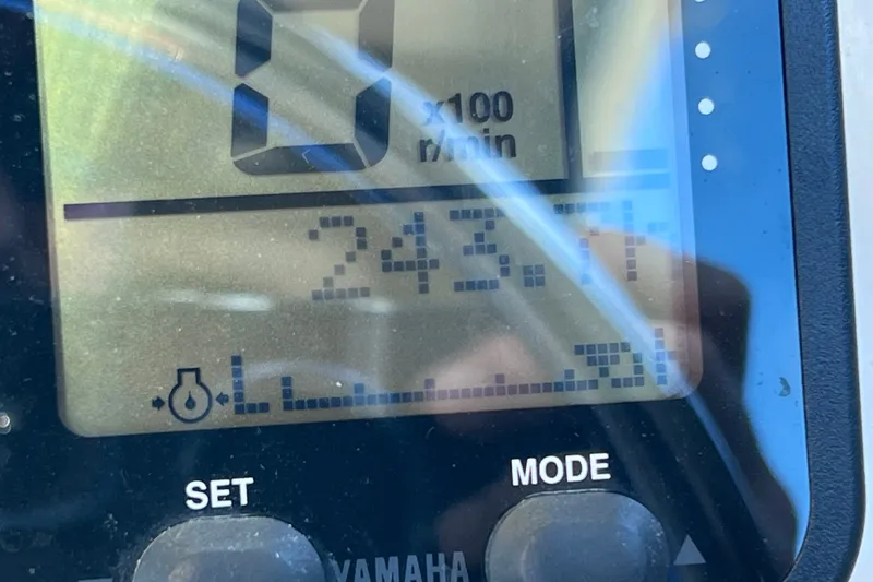 Slide: The Image of Close-up of a Yamaha boat display showing 243.1 hours on a Parker 2320 SL Sport Cabin. - 31