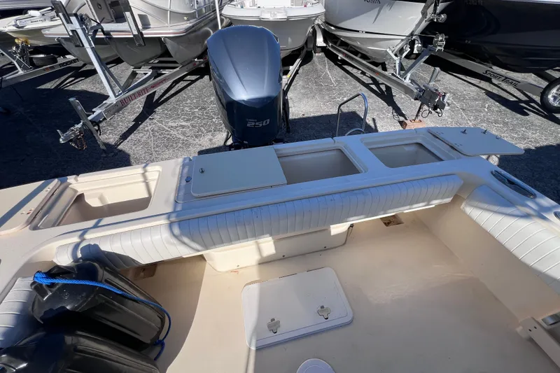 Slide: The Image of 2012 Parker 2320 SL Sport Cabin boat interior with Yamaha 250 engine. - 15
