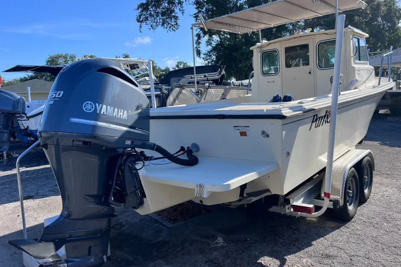 Slide: The Image of 2012 Parker 2320 SL Sport Cabin boat with Yamaha 150 outboard motor on trailer. - 6
