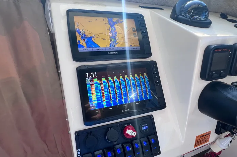 Slide: The Image of Control panel of a 2012 Parker 2320 SL Sport Cabin with Garmin navigation displays. - 32