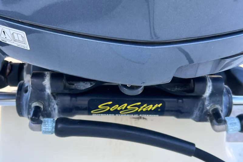 Slide: The Image of Close-up of SeaStar hydraulic steering on 2012 Parker 2320 SL Sport Cabin boat. - 16