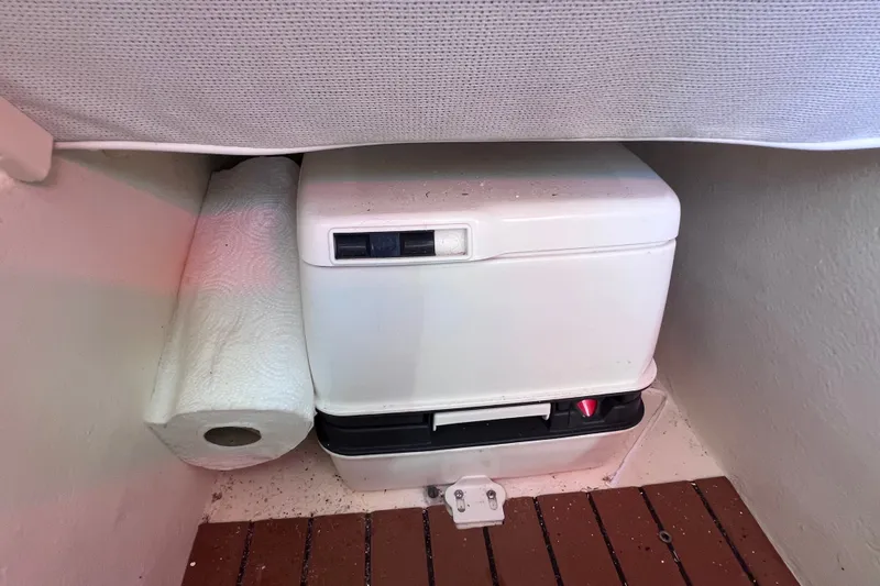 Slide: The Image of Portable toilet and paper towel in 2012 Parker 2320 SL Sport Cabin boat. - 37