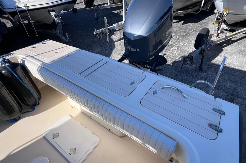 Slide: The Image of 2012 Parker 2320 SL Sport Cabin boat with Yamaha 250 engine, docked on trailer. - 12