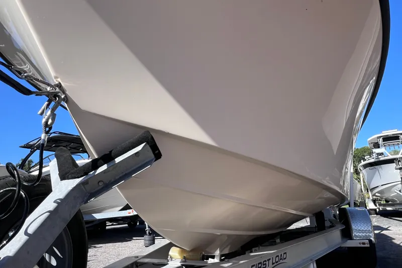 Slide: The Image of 2012 Parker 2320 SL Sport Cabin boat on trailer, close-up view. - 8
