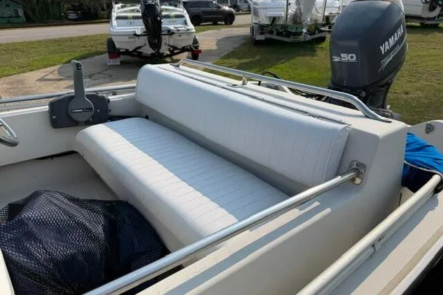 Slide: The Image of 1988 Boston Whaler 150 Super Sport boat interior with Yamaha outboard motor. - 7
