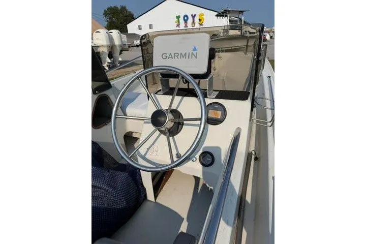 Slide: The Image of 1988 Boston Whaler 150 Super Sport boat interior with Garmin navigation system. - 16