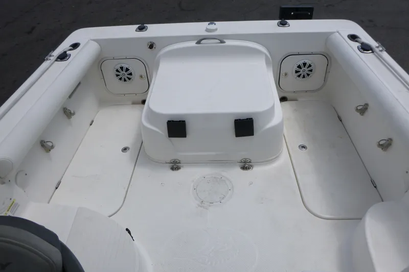 Slide: The Image of 2010 Trophy 2152 Walkaround boat interior with seating and storage compartments. - 12