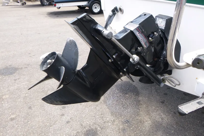 Slide: The Image of 2010 Trophy 2152 Walkaround boat with MerCruiser outboard motor on pavement. - 14