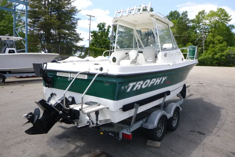 Slide: The Image of 2010 Trophy 2152 Walkaround boat on trailer, parked outdoors. - 2