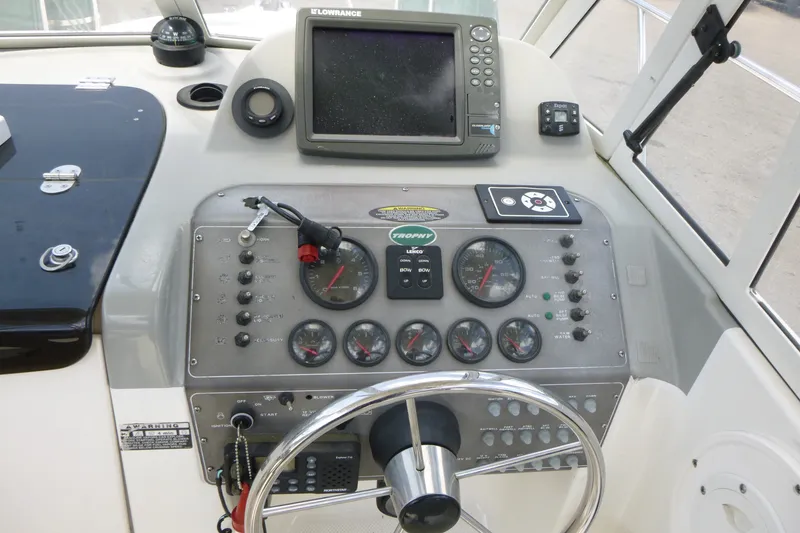 Slide: The Image of Dashboard of a 2010 Trophy 2152 Walkaround boat with navigation instruments. - 10