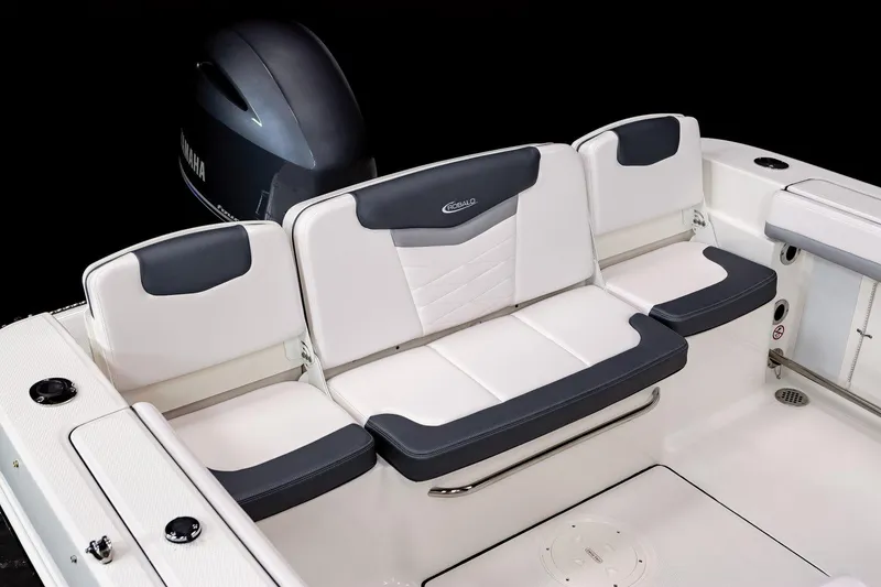 Slide: The Image of Manufacturer Provided Image: 2025 Robalo R207 Dual Console boat interior with cushioned seating and Yamaha engine. - 11