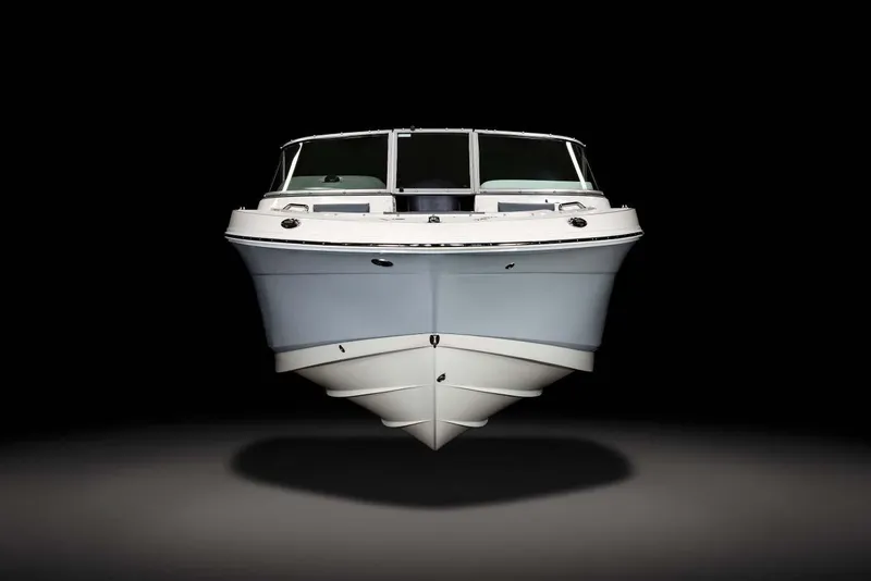 Slide: The Image of Manufacturer Provided Image: 2025 Robalo R207 Dual Console boat, front view, sleek design, black background. - 5