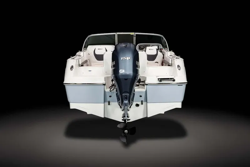 Slide: The Image of Manufacturer Provided Image: 2025 Robalo R207 Dual Console boat, rear view with outboard motor, sleek design. - 6