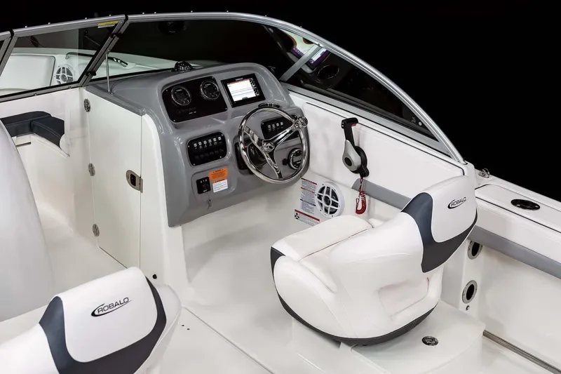 Slide: The Image of Manufacturer Provided Image: 2025 Robalo R207 Dual Console boat interior with modern dashboard and seating. - 9