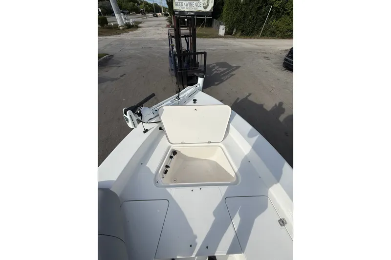 Slide: The Image of 2006 Sea Hunt BX22 boat deck with open storage compartment. - 19