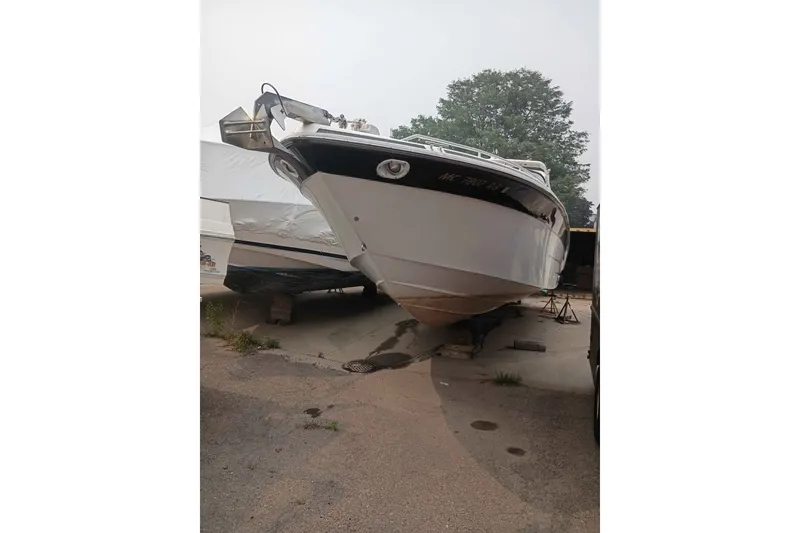 The Image of 1995 Searay SUNSPORT 38 boat on dry dock, awaiting maintenance. - 0