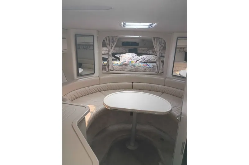 Slide: The Image of Interior of 1995 Searay SUNSPORT 38 boat with seating and table. - 9