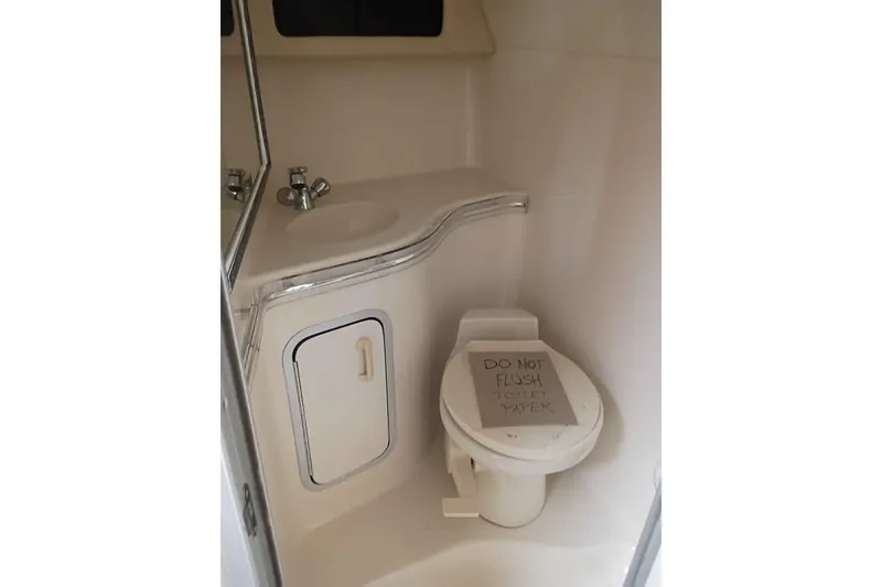 Slide: The Image of 1995 Searay SUNSPORT 38 boat bathroom with toilet and sink. - 8