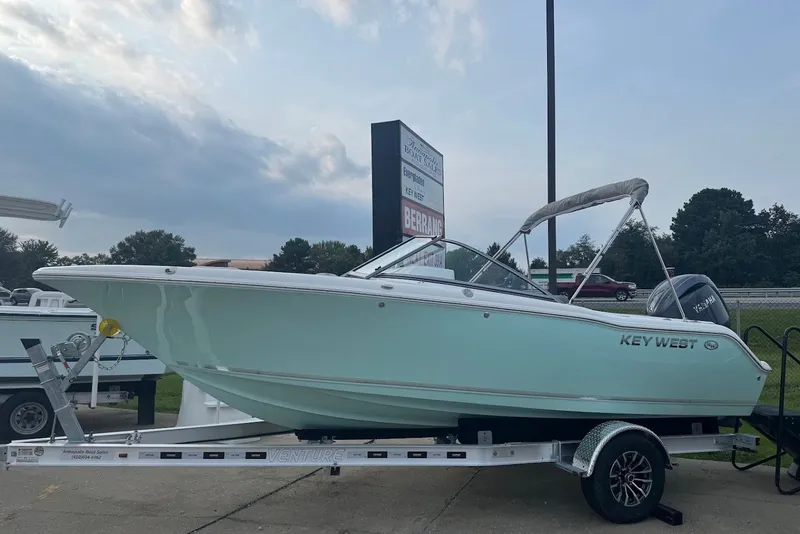 The Image of 2027 Key West 203 DFS boat on trailer, displayed outdoors under cloudy sky. - 0