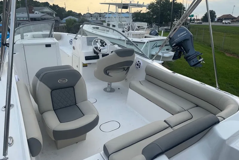 Slide: The Image of 2027 Key West 203 DFS boat interior with seating and steering wheel. - 6