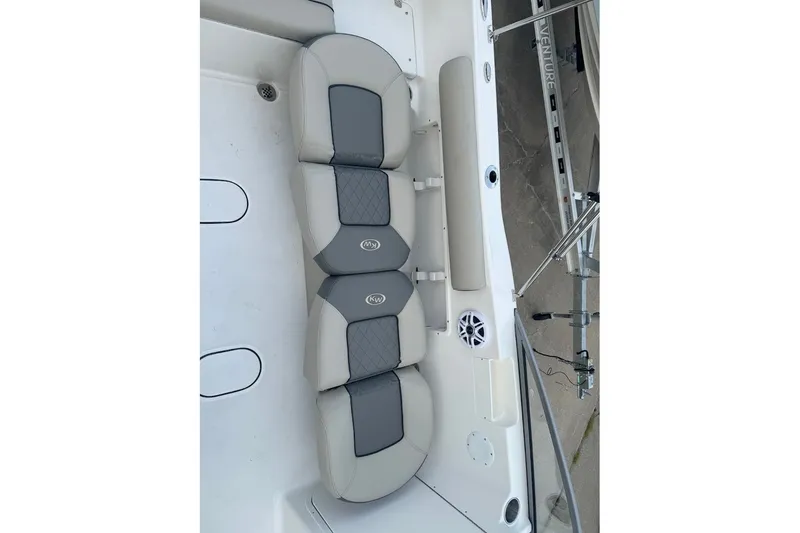 Slide: The Image of 2027 Key West 203 DFS boat interior with gray cushioned seating and speaker system. - 15