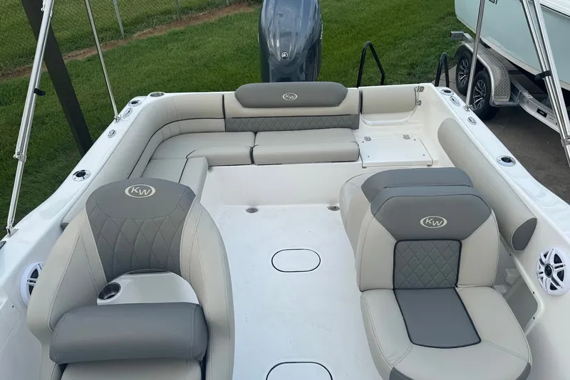 Slide: The Image of 2027 Key West 203 DFS boat interior with gray seating and modern design. - 14