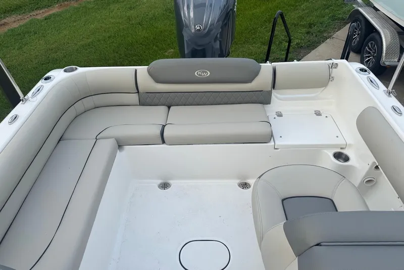 Slide: The Image of Interior view of a 2027 Key West 203 DFS boat with cushioned seating. - 9