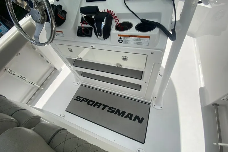Slide: The Image of 2022 Sportsman Open 232 Center Console interior with steering wheel and control panel. - 19