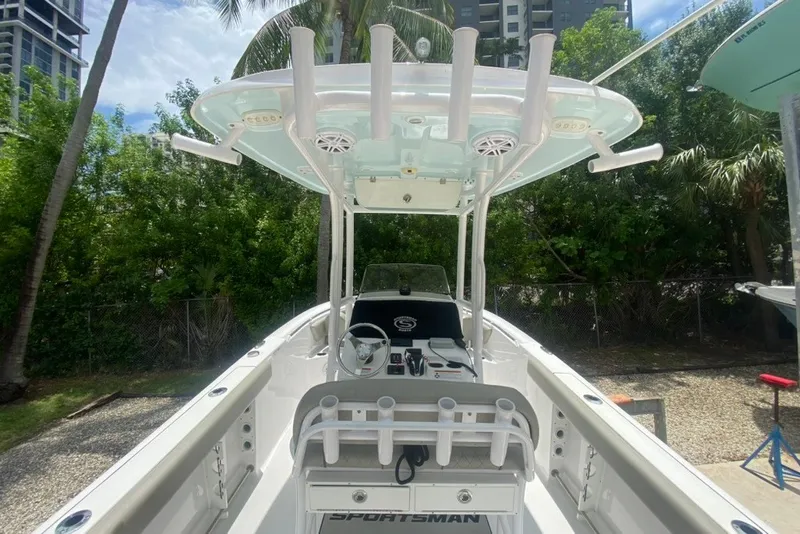 Slide: The Image of 2022 Sportsman Open 232 Center Console boat with T-top and rod holders. - 15