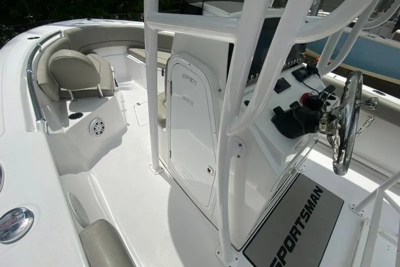 Slide: The Image of 2022 Sportsman Open 232 Center Console boat interior with steering wheel and seating area. - 27