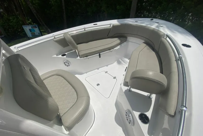 Slide: The Image of 2022 Sportsman Open 232 Center Console boat with cushioned seating and sleek design. - 21