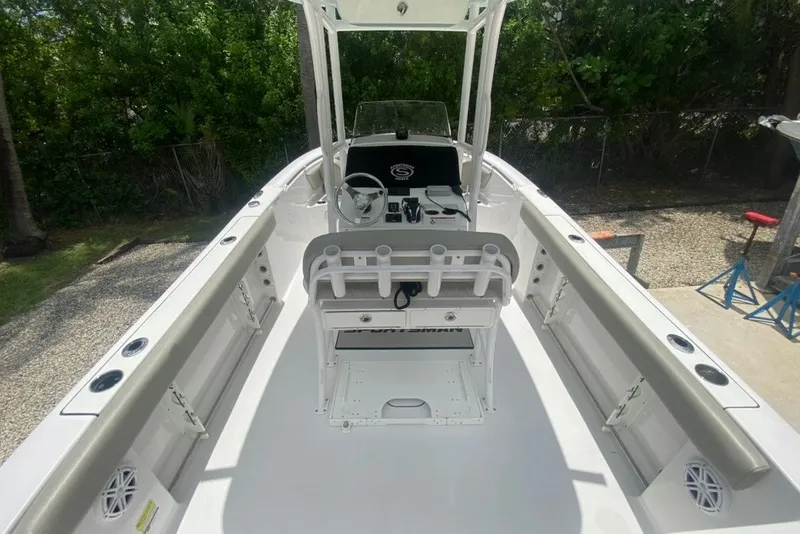 Slide: The Image of 2022 Sportsman Open 232 Center Console boat with spacious deck and modern controls. - 14