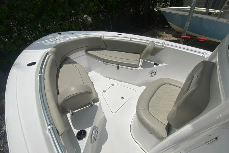 Slide: The Image of 2022 Sportsman Open 232 Center Console boat with spacious seating and modern design. - 22