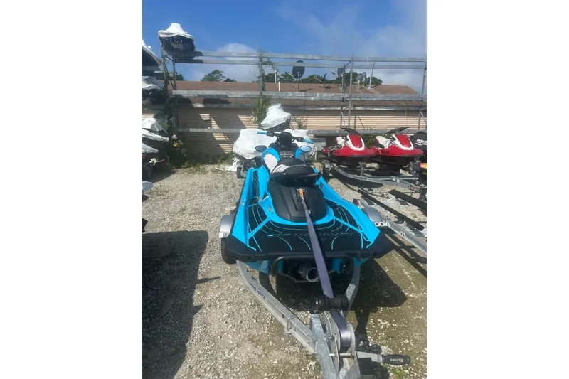Slide: The Image of 2022 Yamaha WaveRunner GP HO in storage, vibrant blue color, parked outdoors. - 8
