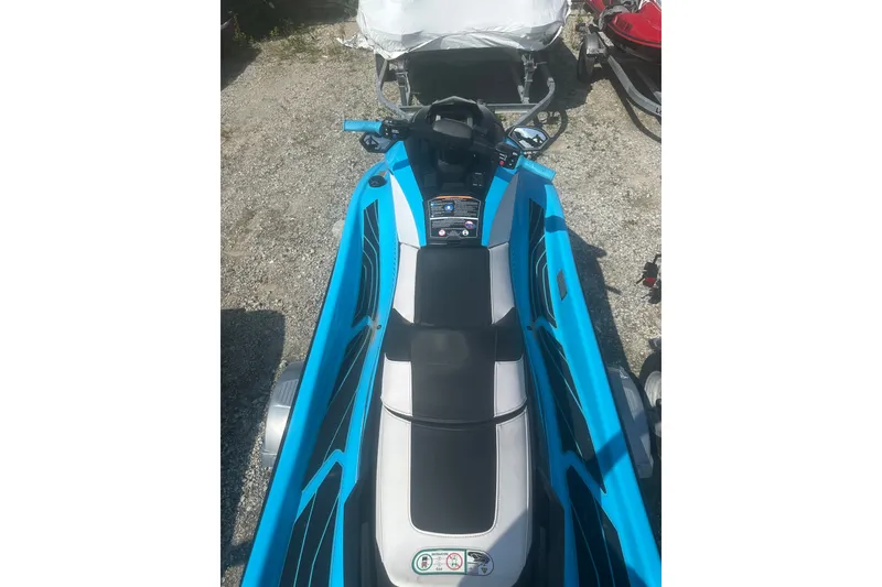 Slide: The Image of 2022 Yamaha WaveRunner GP HO in vibrant blue, parked on gravel. - 9