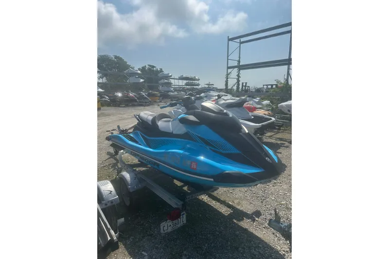 Slide: The Image of 2022 Yamaha WaveRunner GP HO in blue, parked on a trailer outdoors. - 4