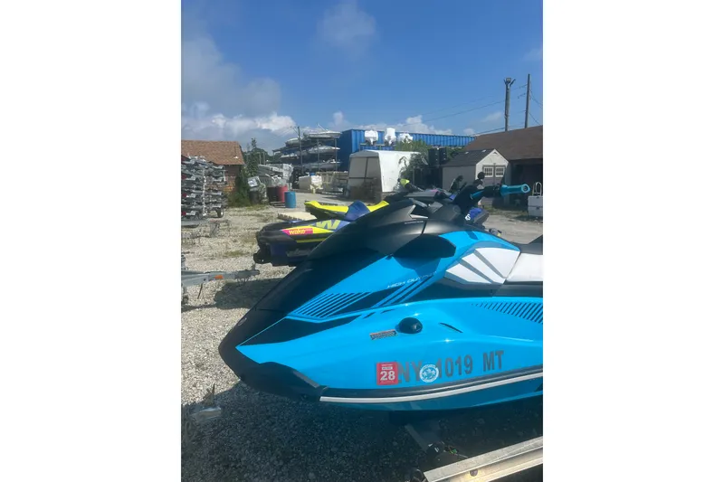Slide: The Image of 2022 Yamaha WaveRunner GP HO in blue, parked outdoors on gravel. - 3