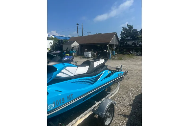 Slide: The Image of 2022 Yamaha WaveRunner GP HO in blue on a trailer, outdoor setting. - 6